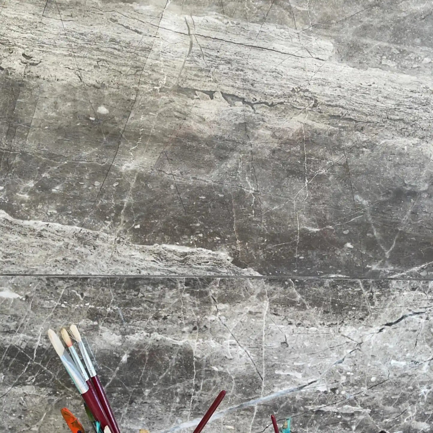 Black marble-effect porcelain tile wall with bold veining – Athena Nero