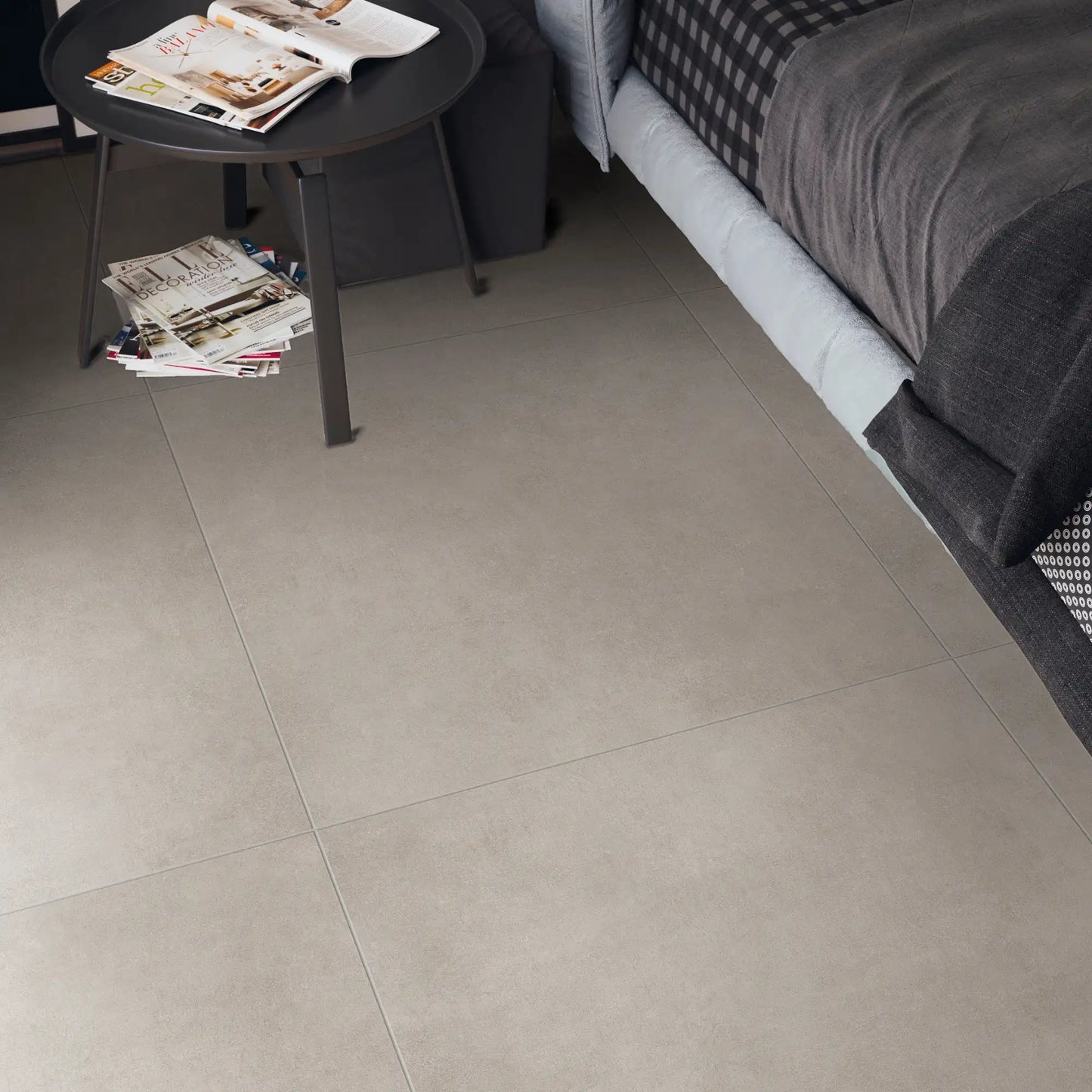 Bedroom interior with grey concrete effect porcelain tile flooring, Magnum Grey.