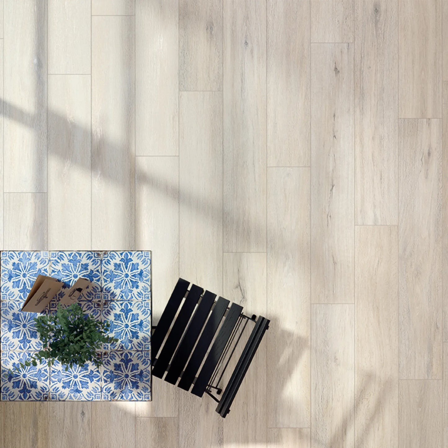 Top view of light oak wood-effect porcelain tiles with subtle grain and soft neutral shading - Firenze Sbiancato