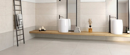 Beige and taupe 60x120 porcelain tiles laid horizontally on a bathroom wall