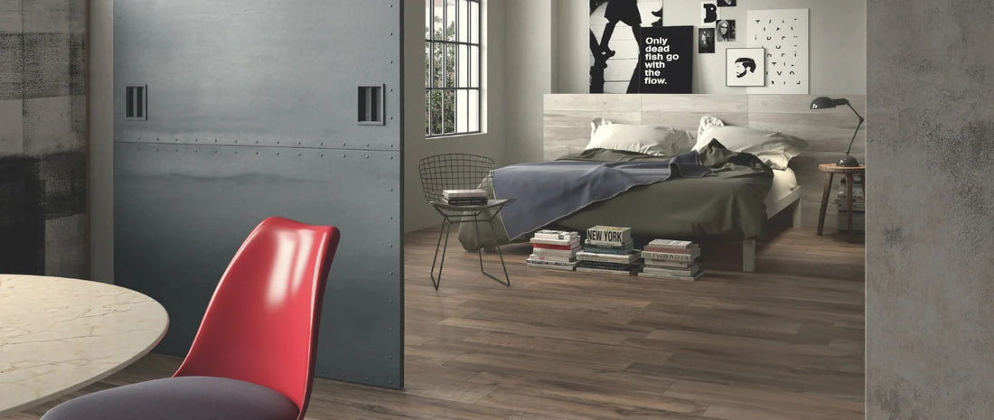 Wood-effect porcelain tile flooring in a modern bedroom, featured in the bedroom flooring guide (Week 7)