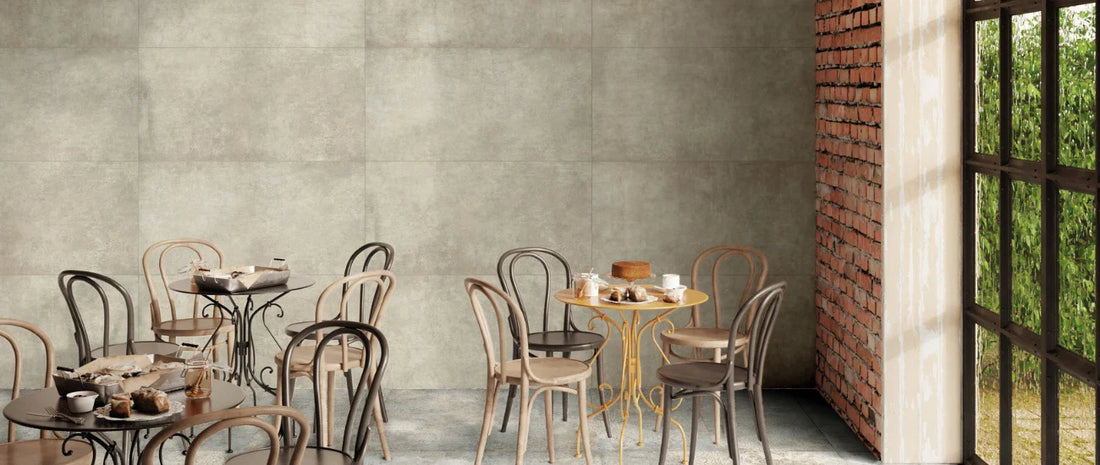 Beige and grey porcelain tiles in a modern cafe interior with tables and chairs