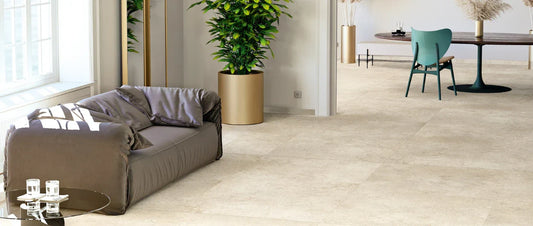 Beige porcelain stone effect tiles in modern open space living room with large format flooring