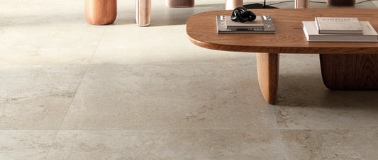beige stone effect porcelain tile 90x90 floor close-up with modern wooden coffee table