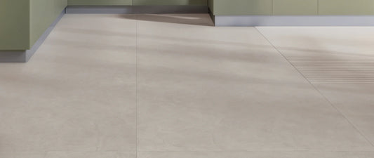 Taupe concrete-effect porcelain tiles in 120x120 large format on a kitchen floor