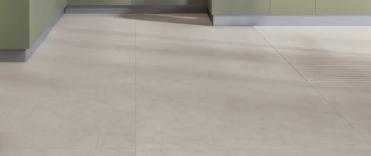 Taupe concrete-effect porcelain tiles in 120x120 large format on a kitchen floor