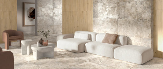 Living room with decorative porcelain tiles in warm greige tones, paired with wood-effect tiles