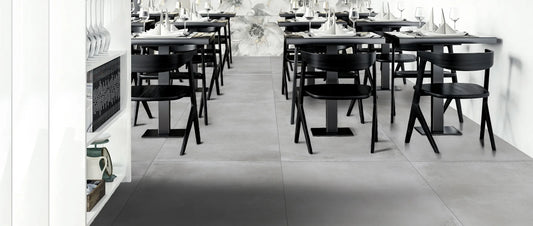 Grey concrete-effect porcelain tiles on a restaurant floor