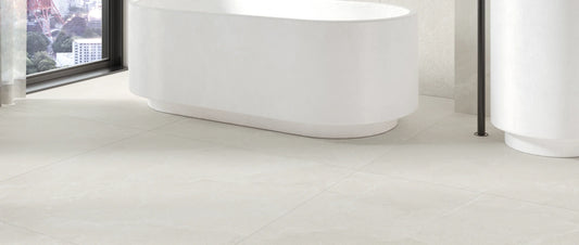 Ivory stone effect porcelain tiles on a contemporary bathroom floor