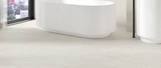 Ivory stone effect porcelain tiles on a contemporary bathroom floor