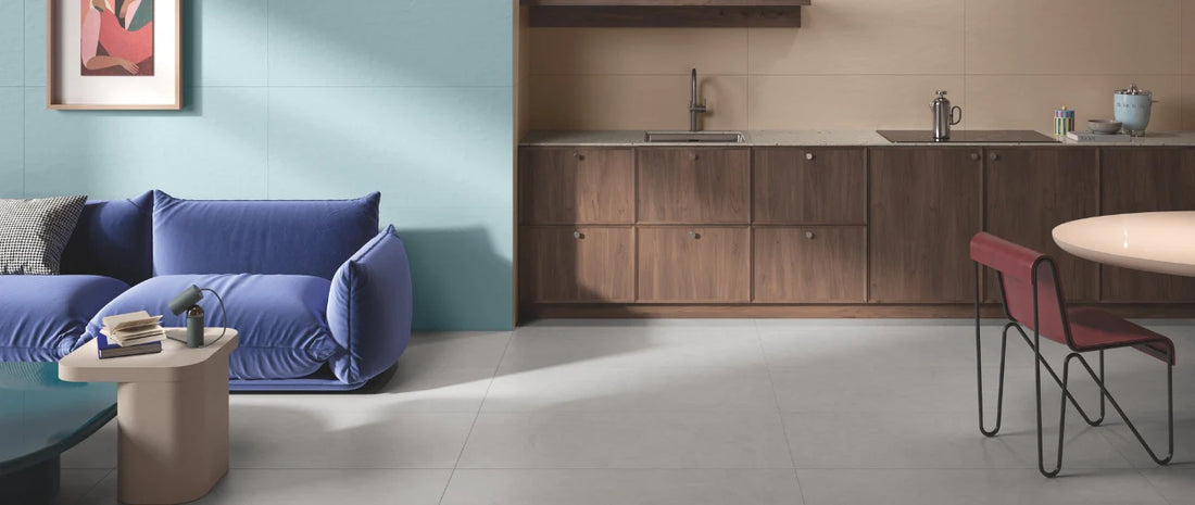 Large-format porcelain tiles in a modern open-plan living room with kitchen