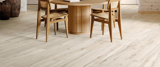 Light natural wood-effect porcelain tile flooring in modern dining room