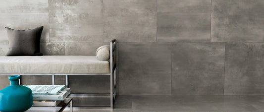 Metal effect porcelain tiles used on walls and floor in a modern industrial interior