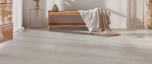 Minimalist living space with taupe concrete effect porcelain tiles in 120x120 format