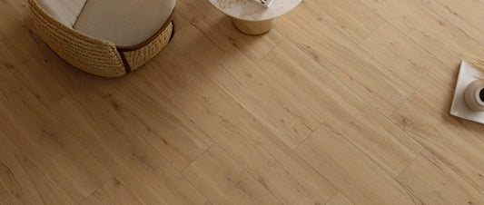 Oak wood effect porcelain tile floor in 30x120 cm plank format, laid in a contemporary living room