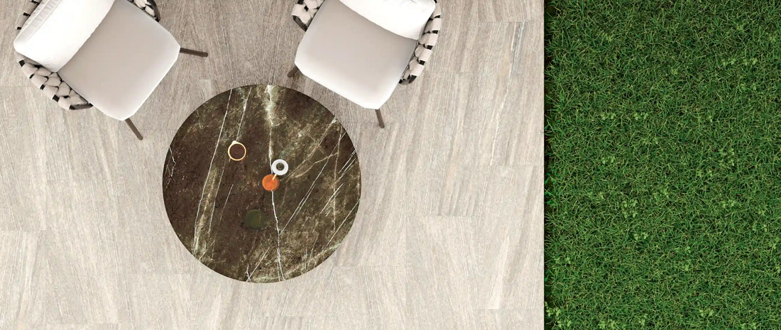 Light grey stone-effect outdoor porcelain tiles on a garden terrace, seen from above