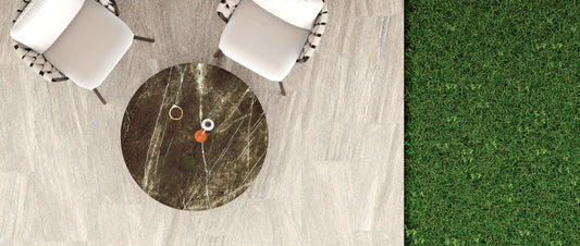 Light grey stone-effect outdoor porcelain tiles on a garden terrace, seen from above
