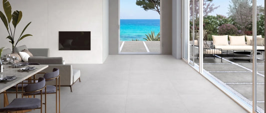 Porcelain tile flooring in a coastal home with seamless indoor outdoor transition and ocean view