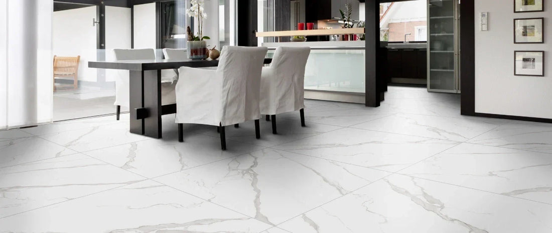 Modern dining room with satin marble-effect porcelain tile flooring in large format.