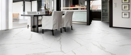 Modern dining room with satin marble-effect porcelain tile flooring in large format.