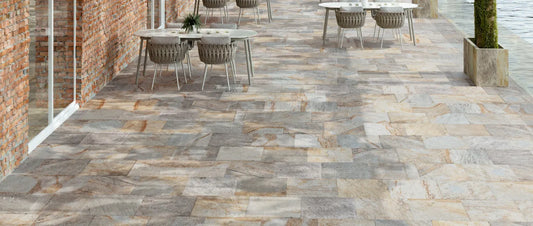 Outdoor porcelain tiles with stone effect in a modern terrace setting