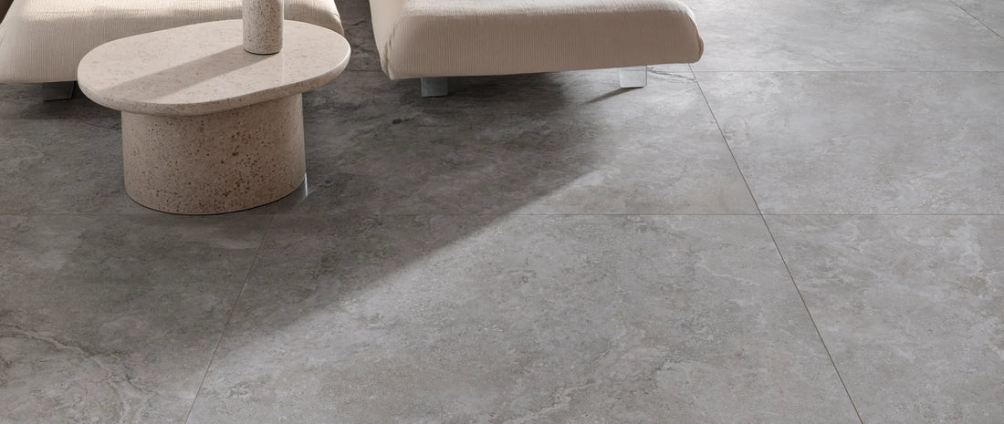 Grey stone-effect porcelain tiles 120x120, large format flooring with subtle veining and matt finish in a contemporary living room