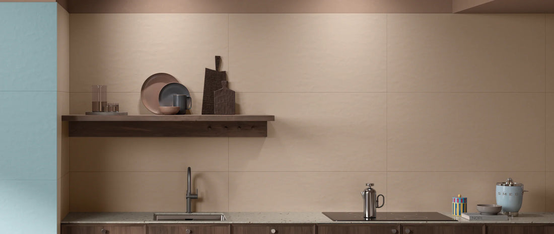 kitchen splashback in taupe resin-effect porcelain tiles, 60x120 format, behind worktop and induction hob