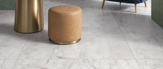 White marble effect porcelain tiles in large format with subtle grey veining in a modern interior