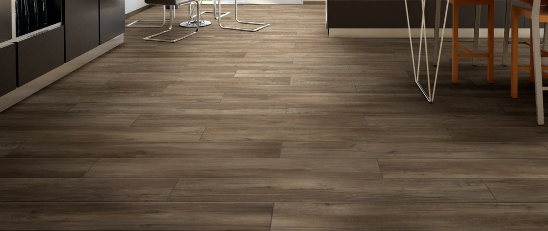 Brown wood effect porcelain floor tiles in a modern finished basement, laid as long planks