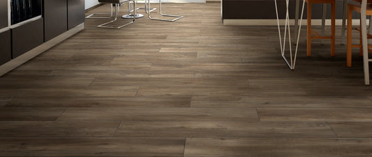 Brown wood effect porcelain floor tiles in a modern finished basement, laid as long planks