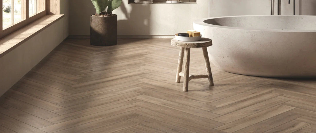 Wood effect porcelain tiles in herringbone pattern installed in modern bathroom