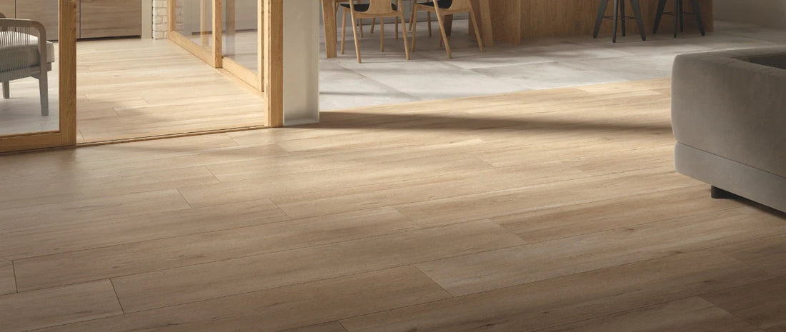 Light oak wood effect porcelain tiles installed in a modern living space with natural light
