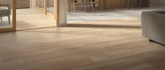 Light oak wood effect porcelain tiles installed in a modern living space with natural light