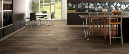 Wood effect porcelain tiles walnut finish installed in a modern kitchen with plank flooring