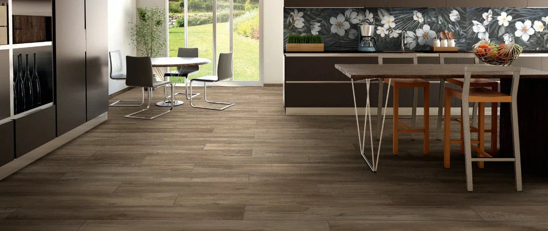 Wood effect porcelain tiles walnut finish installed in a modern kitchen with plank flooring