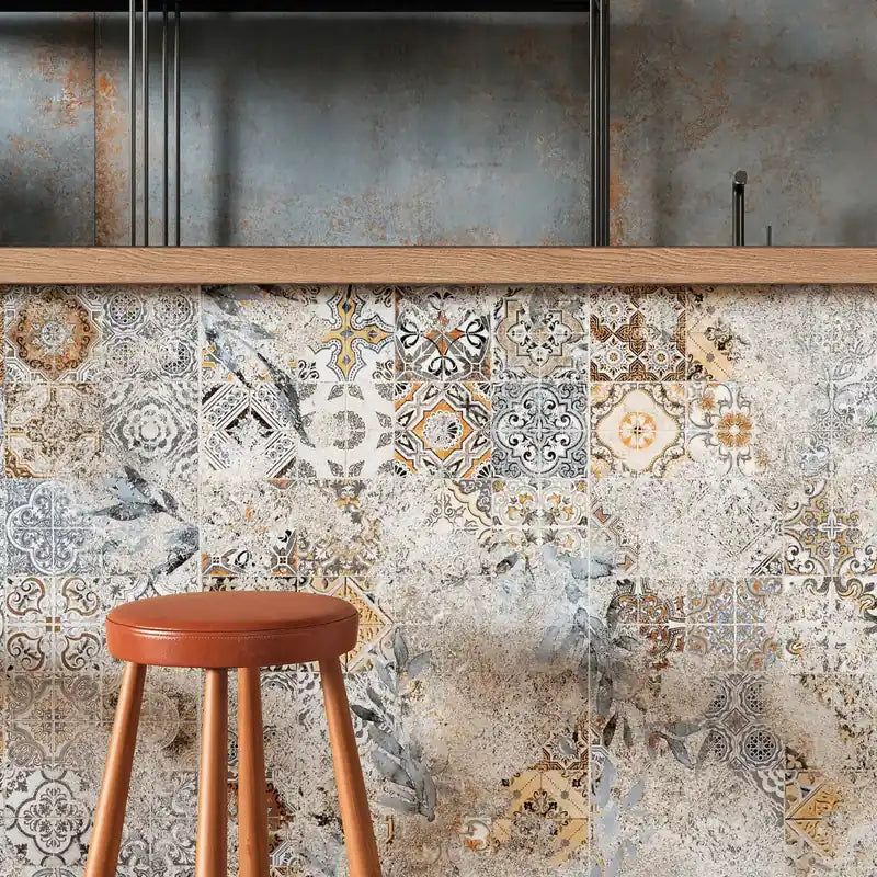 Decorative patchwork porcelain tiles used as cladding on a modern café bar counter.