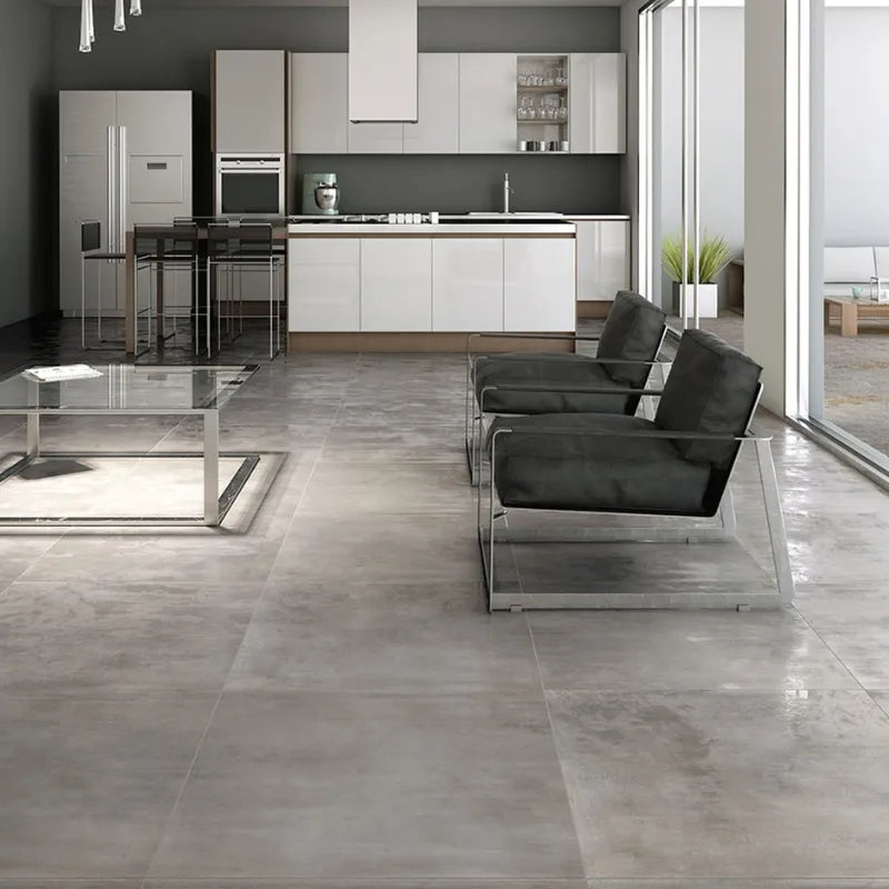 Modern living room with metal-effect porcelain floor tiles in a contemporary open-space design.