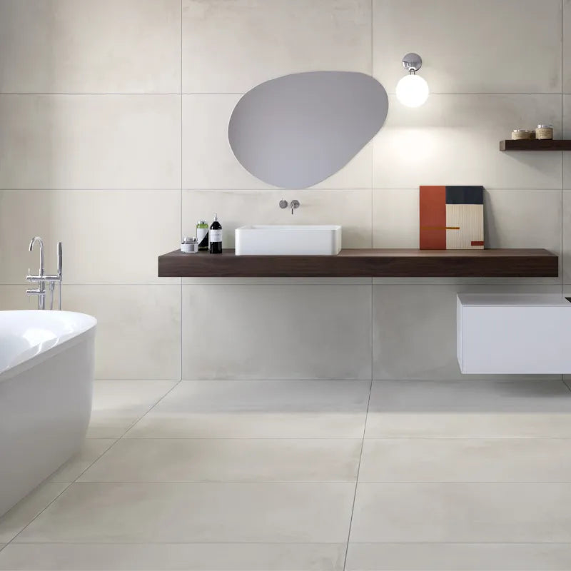 Modern bathroom with large-format grey porcelain tiles on walls and floor.