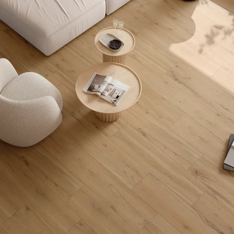 Modern living room featuring oak wood-effect porcelain stoneware tiles with a light, natural finish.