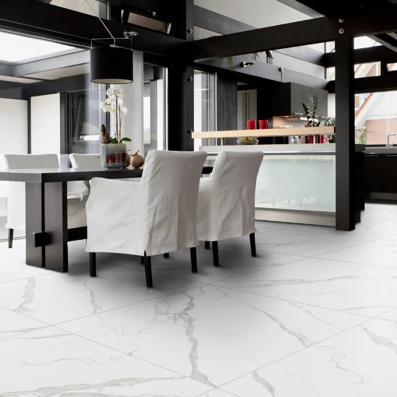 Modern dining room with white marble-effect porcelain stoneware tiles featuring elegant grey veining.
