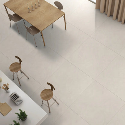 Modern kitchen and dining area with beige concrete-effect porcelain flooring. le resine beige