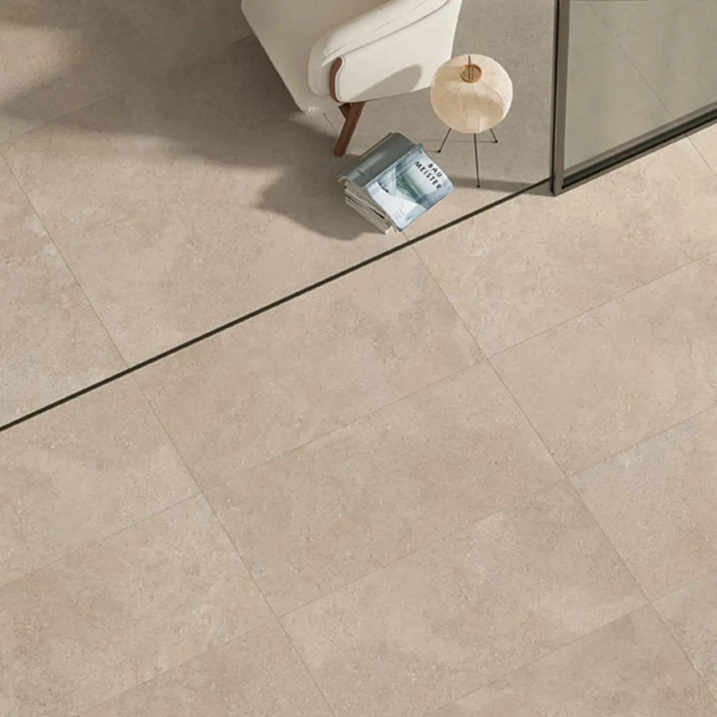 Modern interior space with beige stone-effect porcelain flooring, eterea sabbia