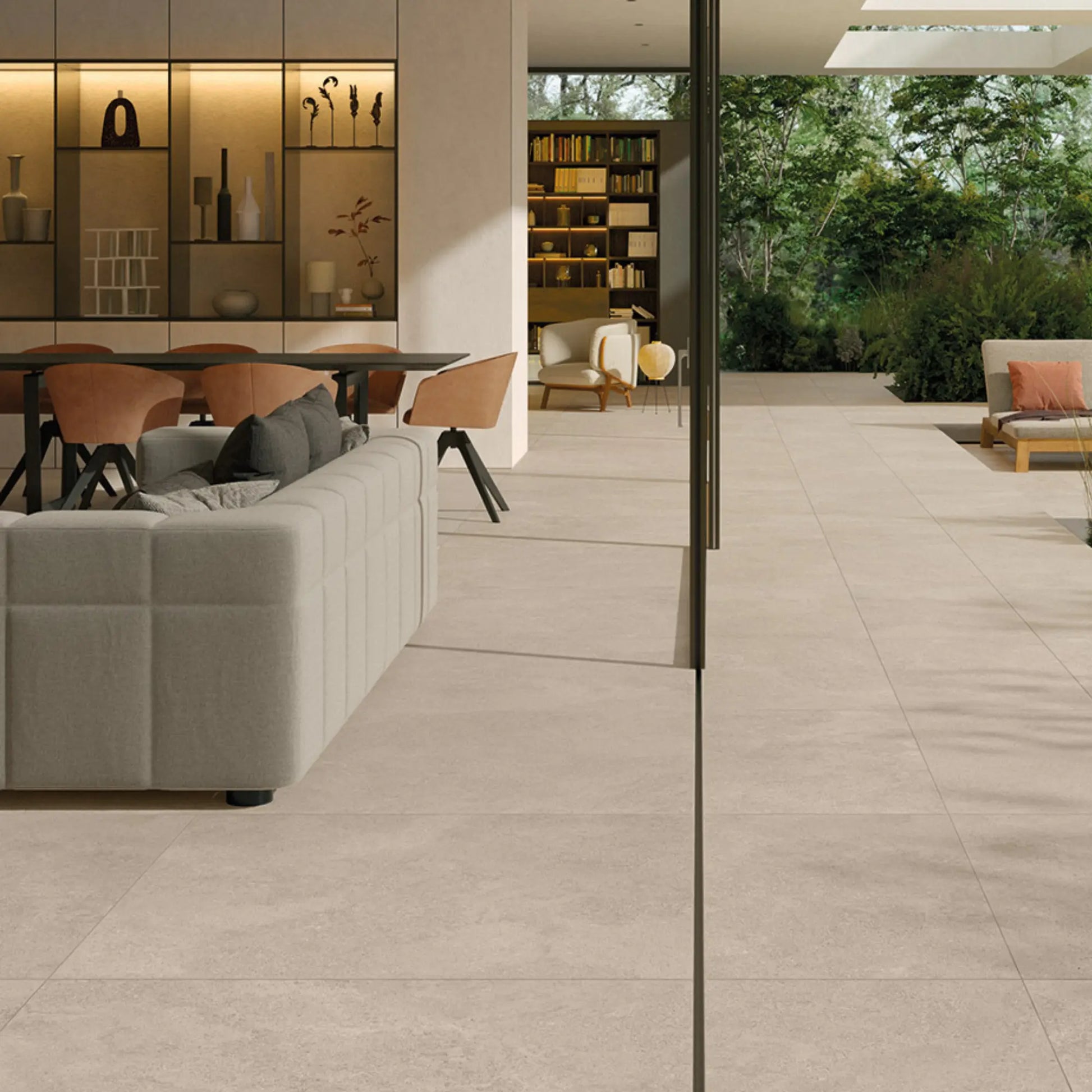 Indoor–outdoor area with beige stone-effect large-format tiles,  Eterea Sabbia 