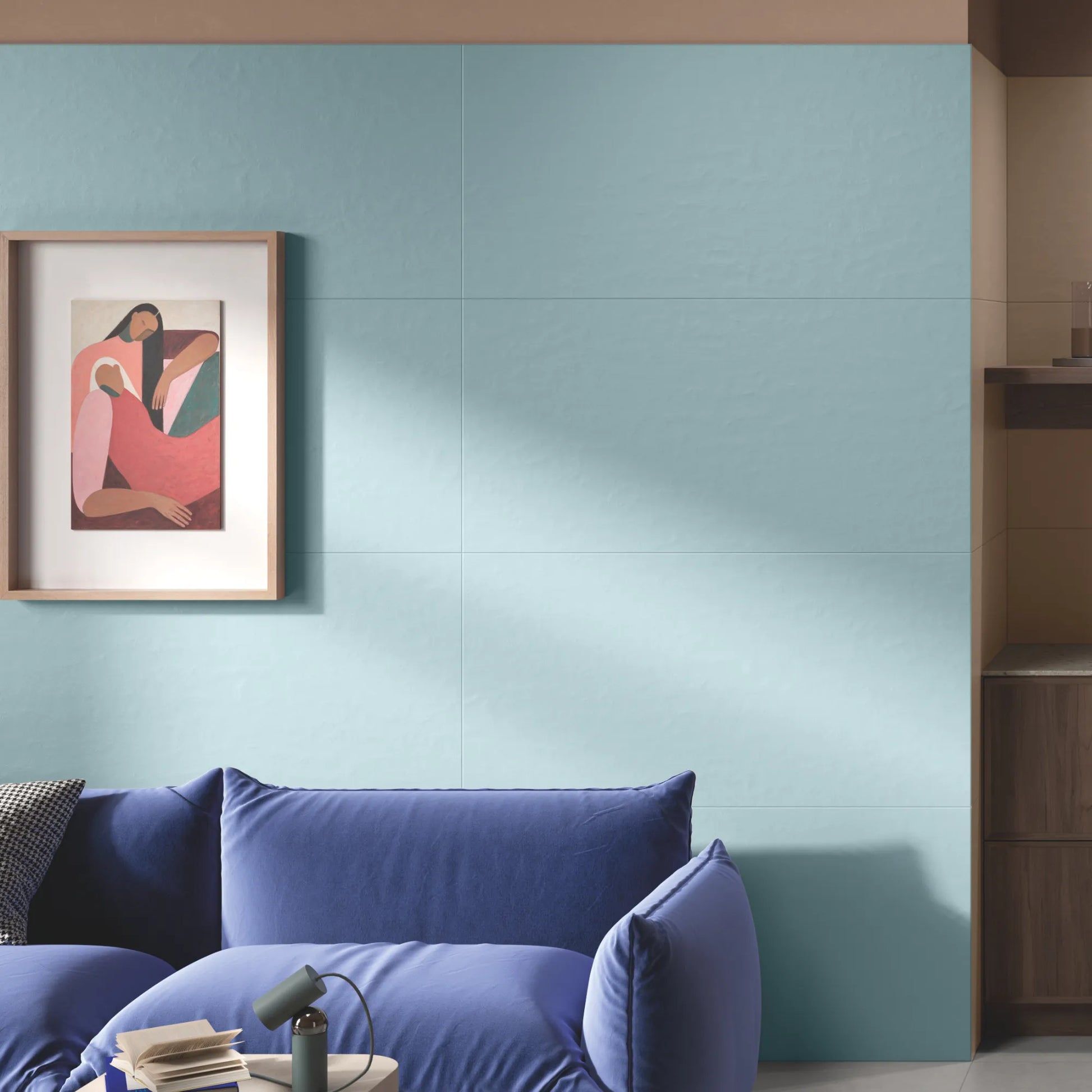 Close up of blue concrete effect porcelain wall tiles in modern living room interior, Le Resine Azzurro