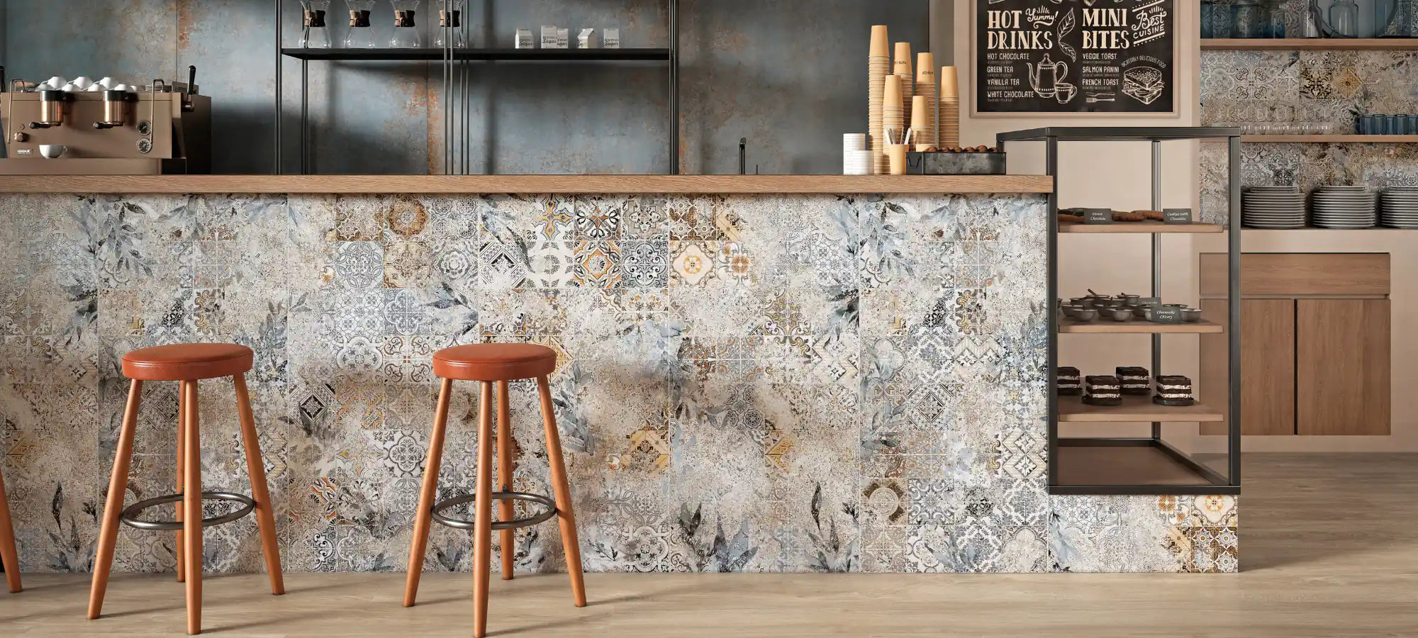 Decorative patchwork porcelain tiles used as cladding on a modern café bar counter.