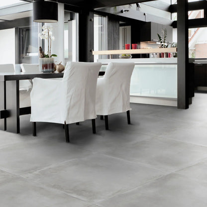 Grey concrete effect porcelain floor in contemporary dining room Caementum Griseo