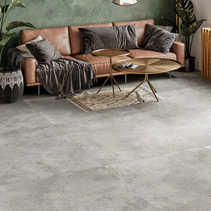 Grey stone effect porcelain floor tile installed in modern living room, Colosseo Grigio 