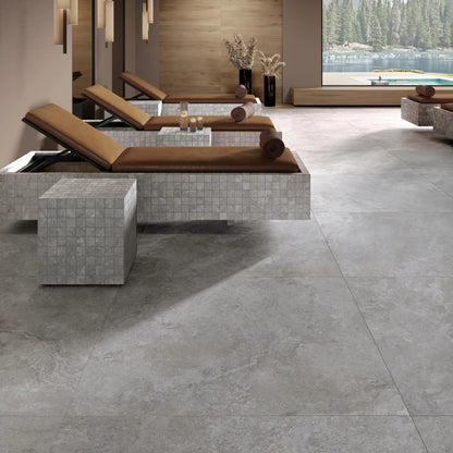 Grey stone effect porcelain tile flooring in a spa interior with natural stone-inspired veining, Dolomia Stone Grey