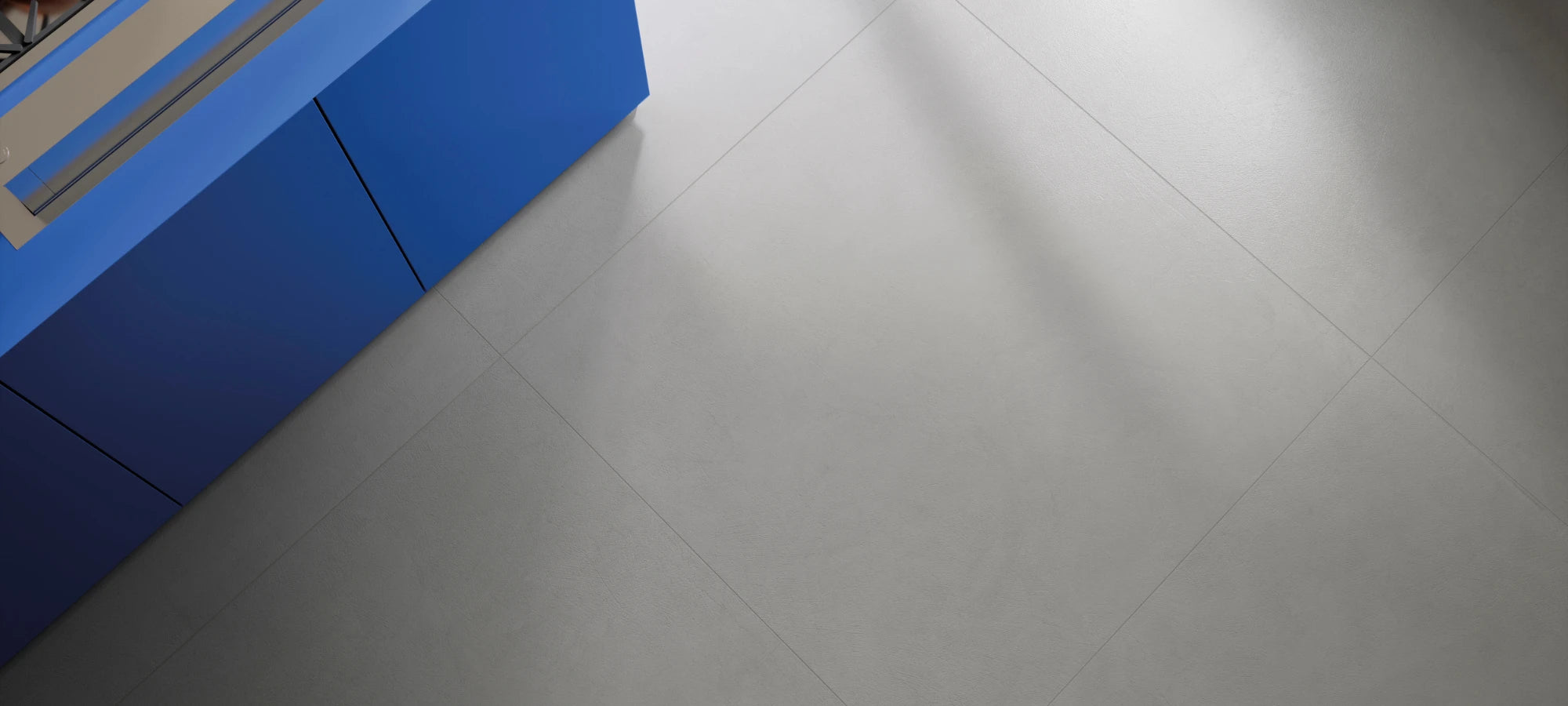 Modern interior featuring a light concrete-effect 120x120 porcelain stoneware tile floor.