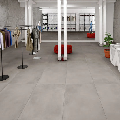 Light grey concrete effect floor tiles in a modern store interior, Caementum Pulvis